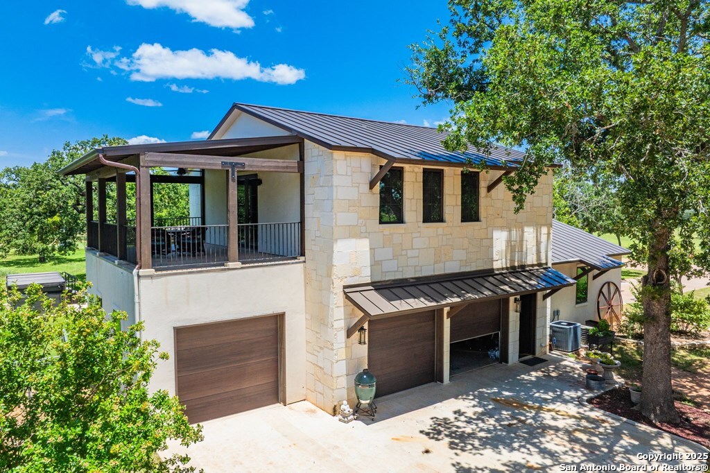 772 Luckenbach Road Fredericksburg, TX 78624 - Photo 67 of 86 a front view of a house with a yard