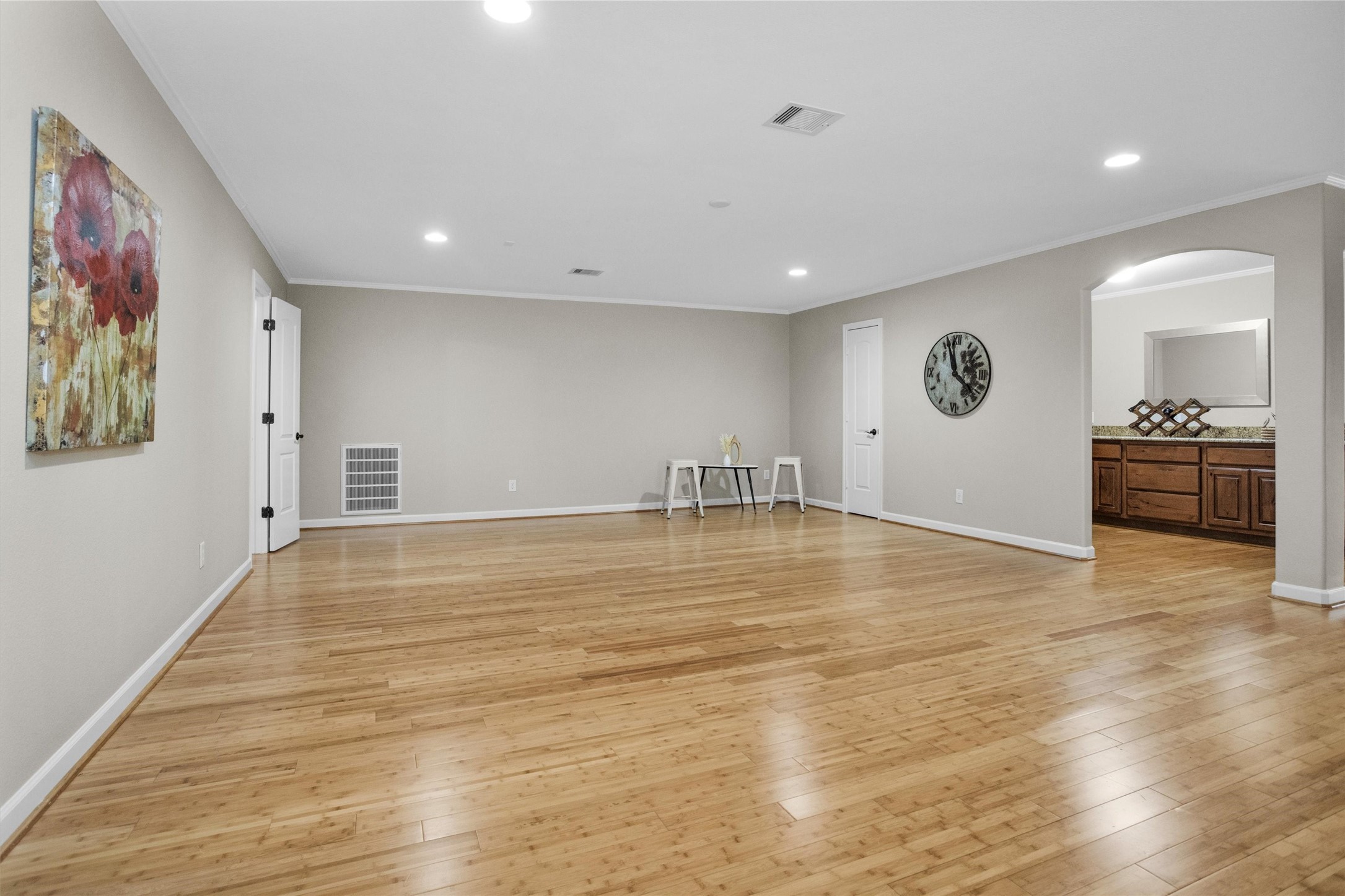 27910 Hansons Court Spring, TX 77386 - Photo 30 of 50 HUGE half story with endless possibilites! Upstairs has all bamboo flooring (including stair treads), crown molding, recessed lighting, storage closet with built-in shelving and a well-equipped kitchenette/wet bar.