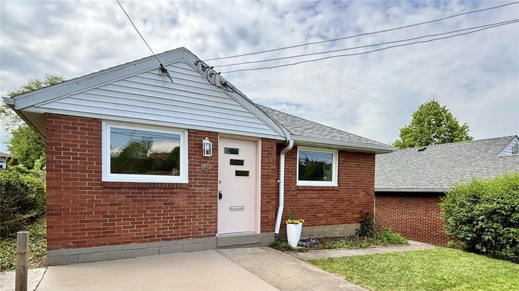 a front view of a house with garage