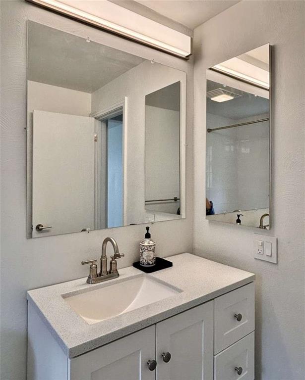 4258 Glen Lytle Road Pittsburgh, PA 15217 - Photo 14 of 19 a bathroom with a sink and a mirror