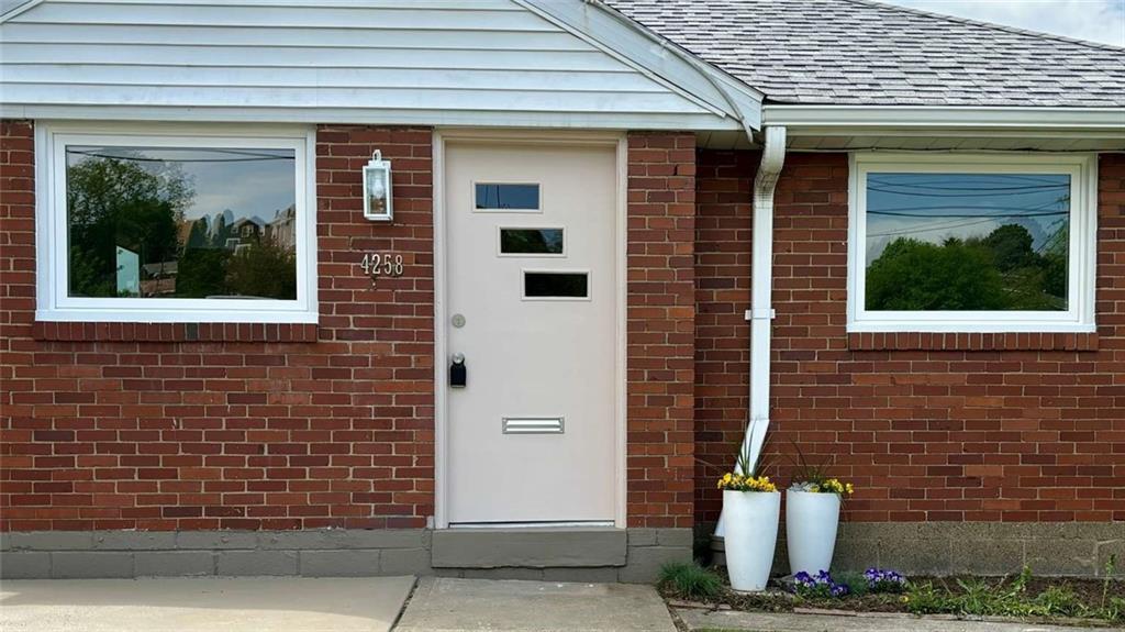 4258 Glen Lytle Road Pittsburgh, PA 15217 - Photo 2 of 19 a front view of a house with a yard