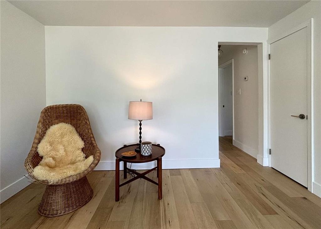 4258 Glen Lytle Road Pittsburgh, PA 15217 - Photo 5 of 19 a room with wooden floor and a chandelier