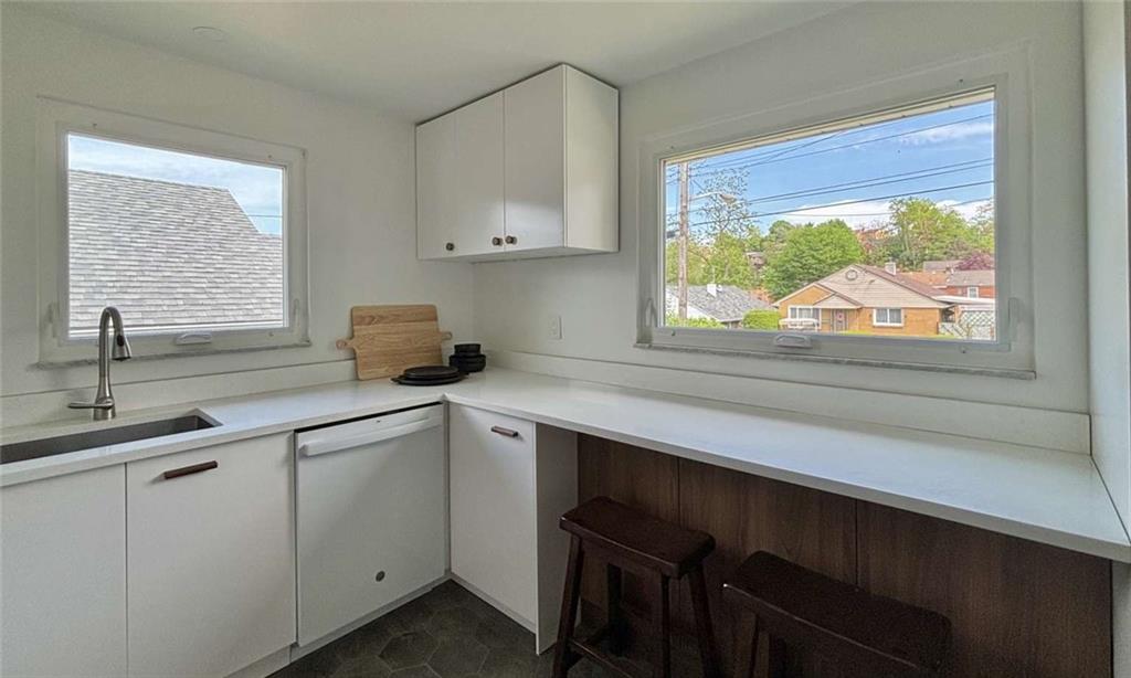 4258 Glen Lytle Road Pittsburgh, PA 15217 - Photo 7 of 19 a kitchen with a sink and cabinets