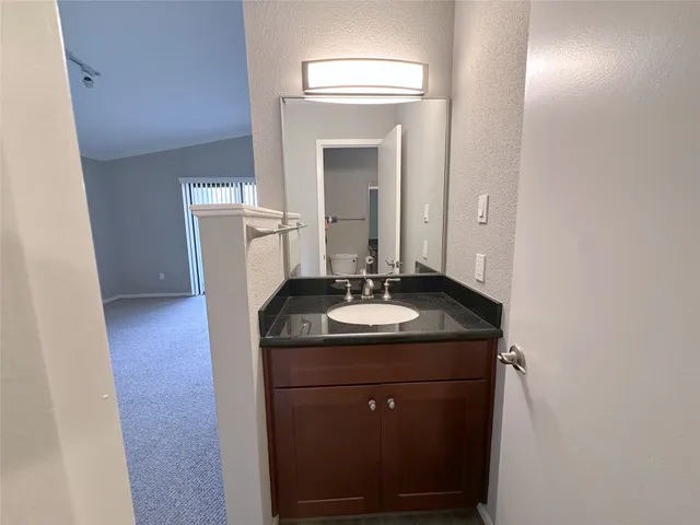 a bathroom with a shower and a toilet