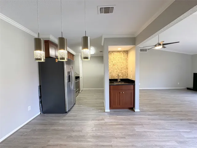 a view of a kitchen cabinets and wooden floor