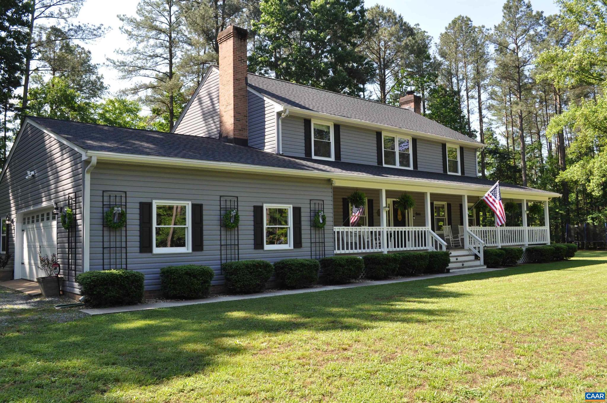 3257 Martin Kings Road Charlottesville, VA 22902 - Photo 2 of 49 a front view of a house with a yard