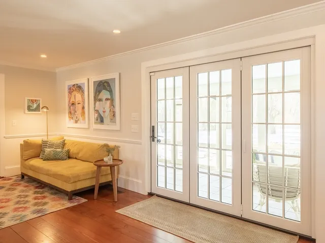 a view of an entryway with wooden floor