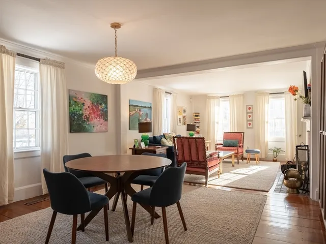 a view of a livingroom with furniture and a window