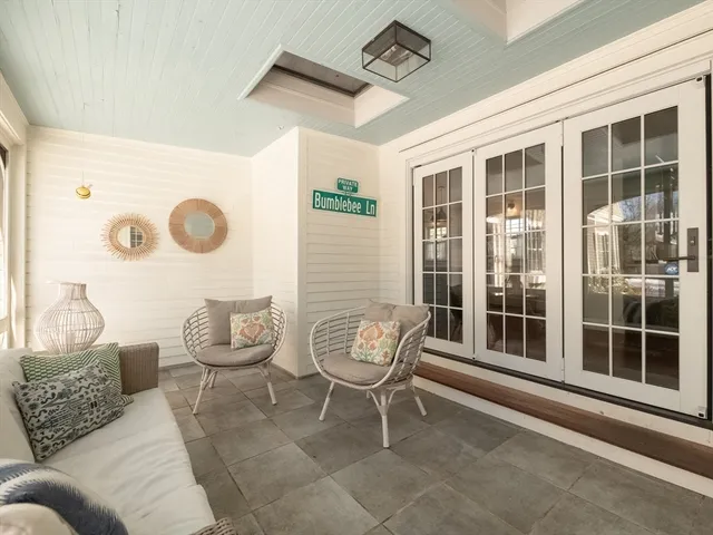a large white kitchen with cabinets