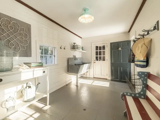 a view of city with snow on the roadside