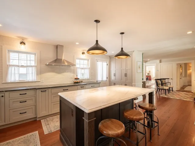 a spacious bathroom with a double vanity sink and a large mirror