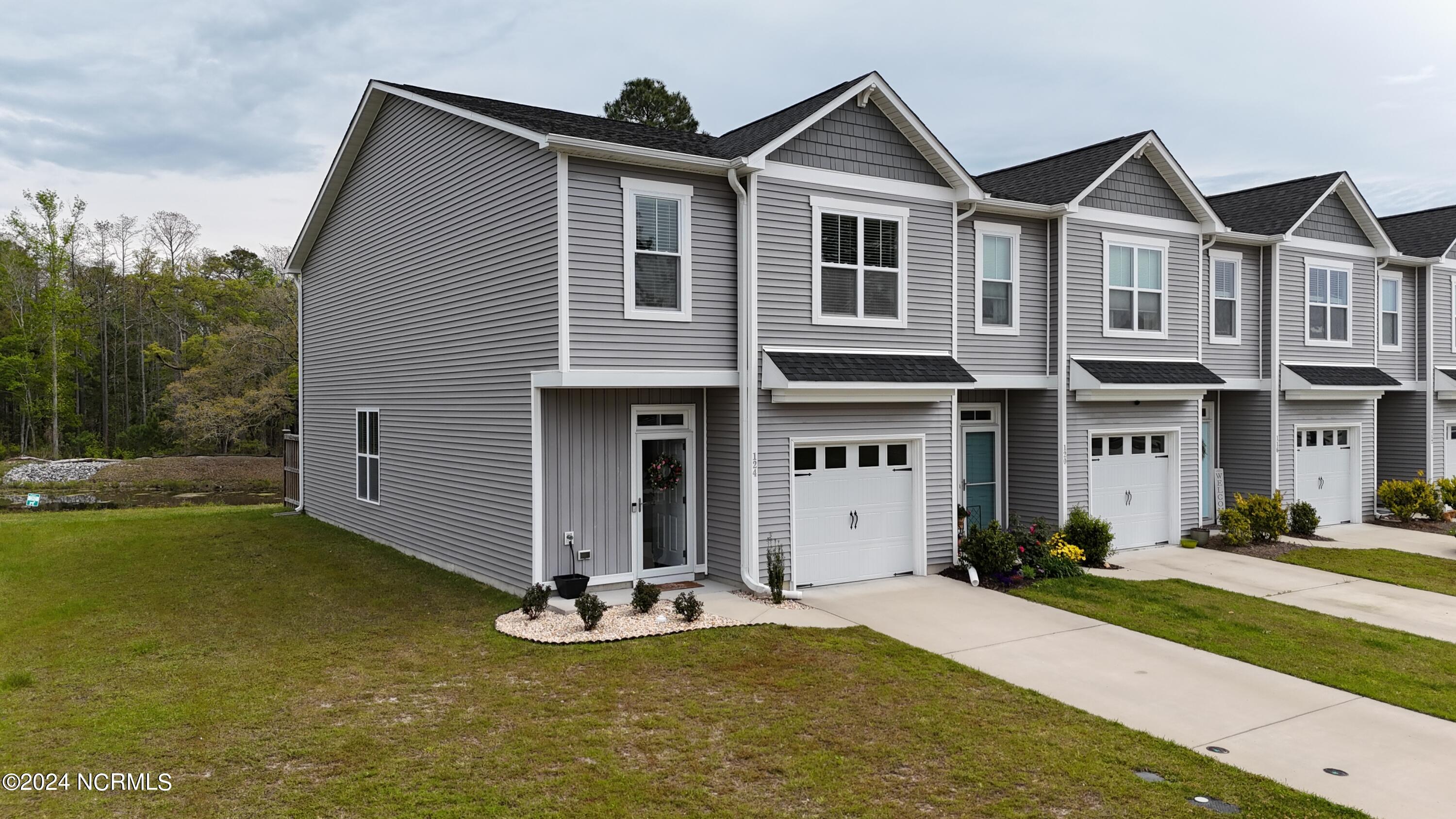 124 Aspen Road Hampstead, NC 28443 - Photo 2 of 35 dji_fly_20240410_120250_0043_17128592595