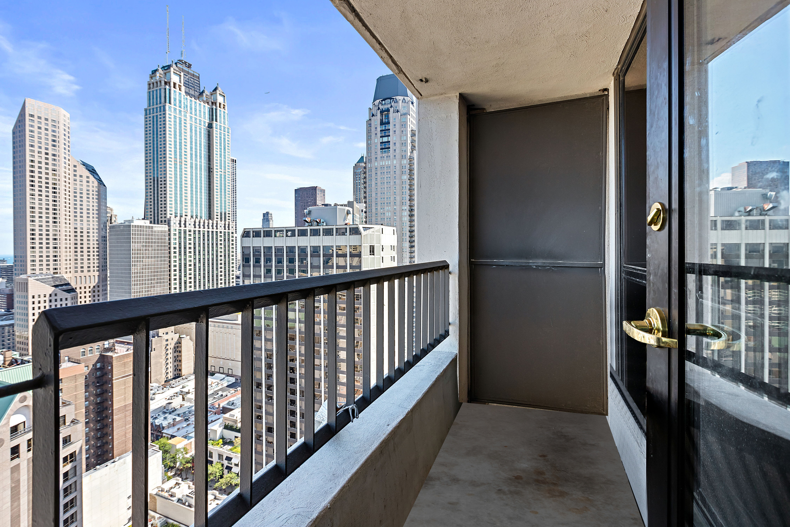 1030 North State Street, Unit 31E Chicago, IL 60610 - Photo 12 of 19 a view of city from a balcony