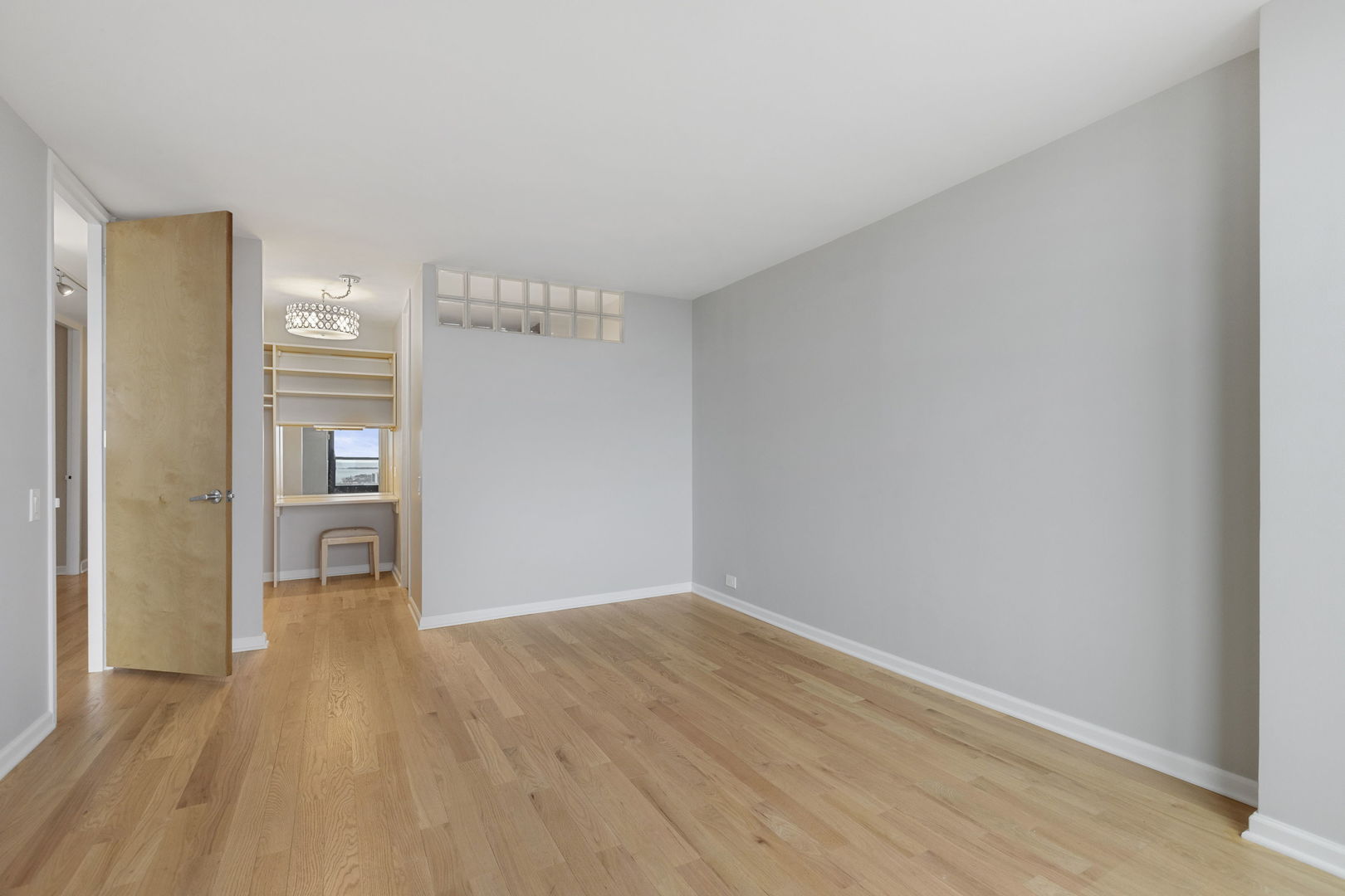 1030 North State Street, Unit 31E Chicago, IL 60610 - Photo 14 of 19 a view of empty room with wooden floor