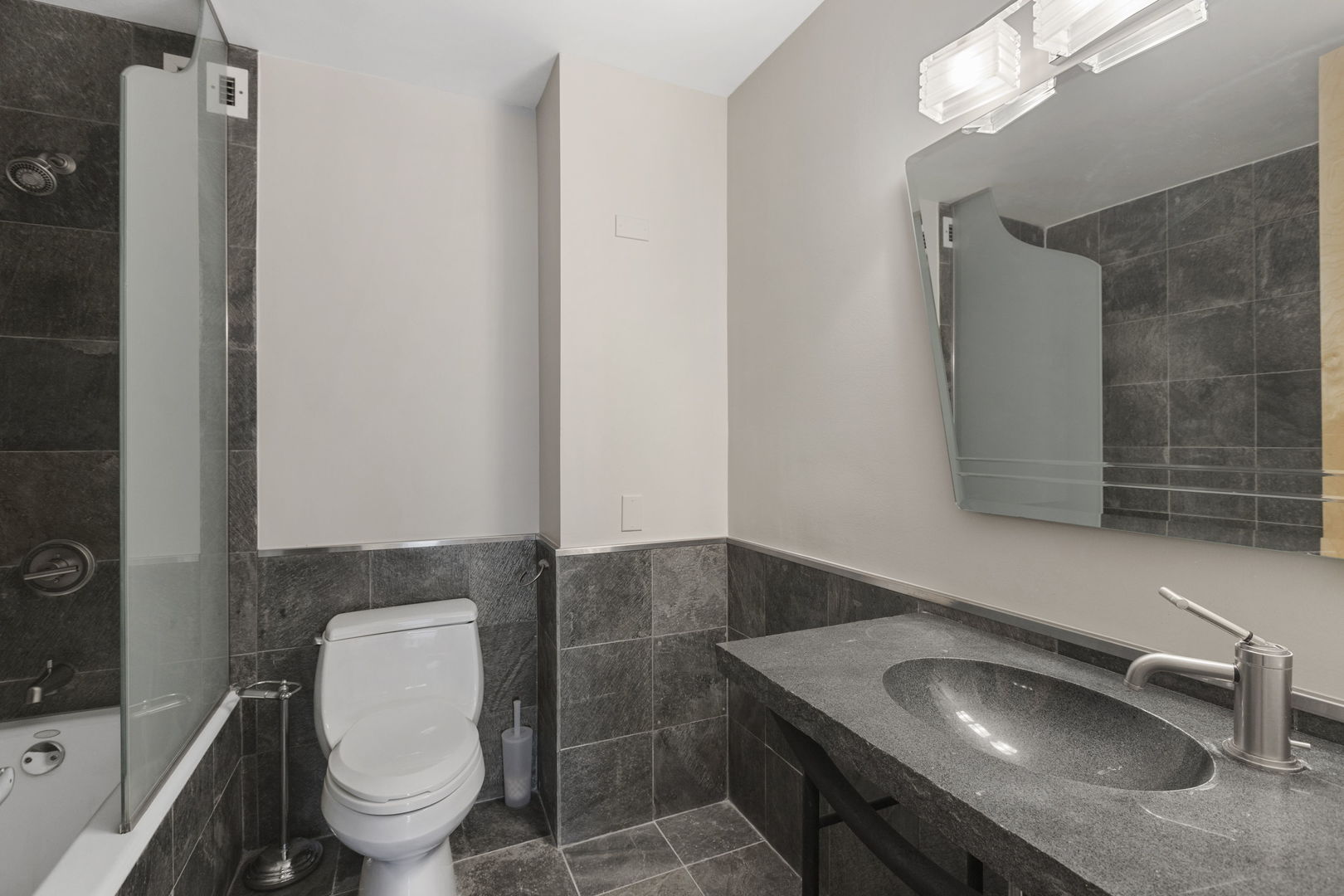 1030 North State Street, Unit 31E Chicago, IL 60610 - Photo 16 of 19 a bathroom with a sink and a toilet