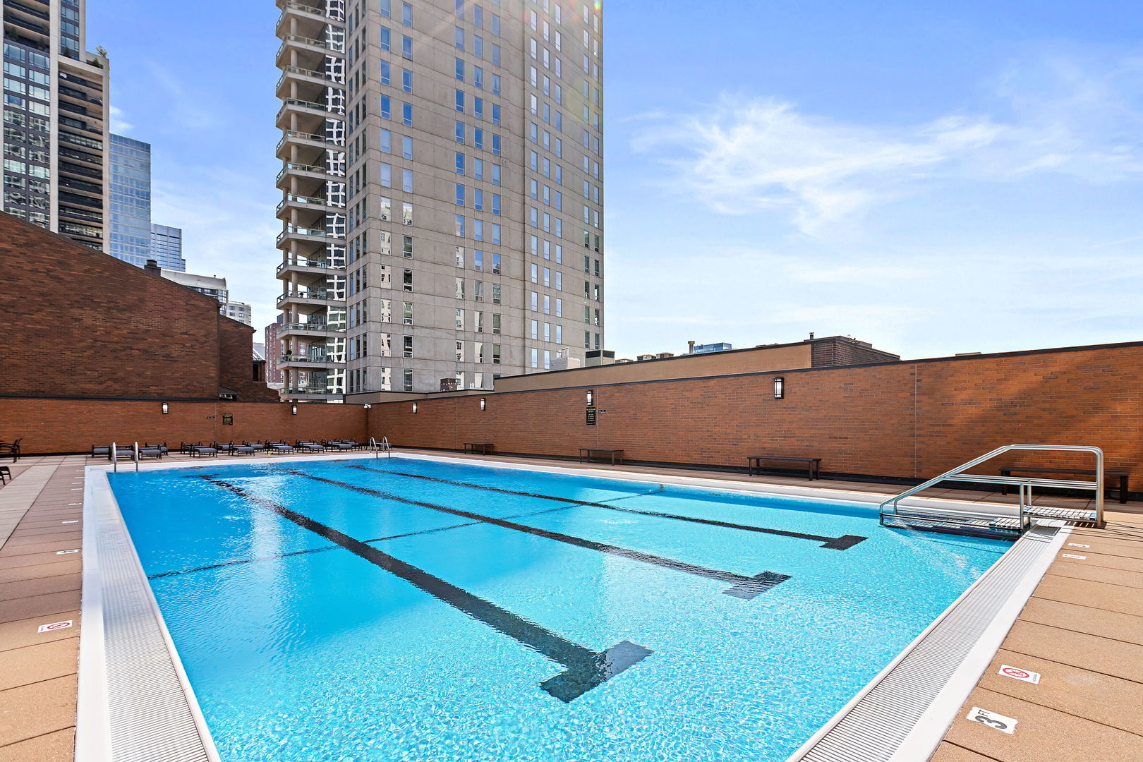 1030 North State Street, Unit 31E Chicago, IL 60610 - Photo 17 of 19 a view of swimming pool with building in background