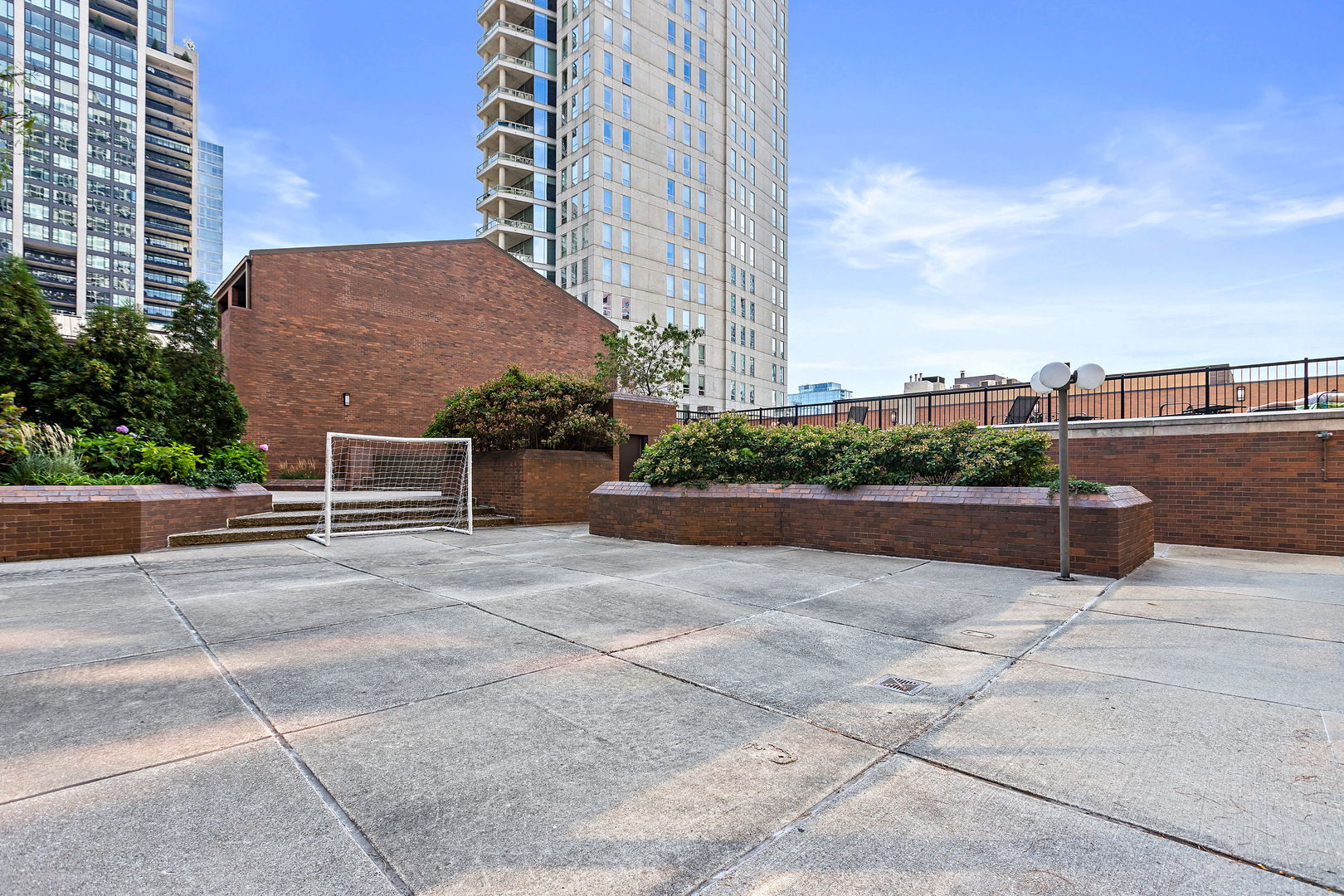 1030 North State Street, Unit 31E Chicago, IL 60610 - Photo 18 of 19 a view of a terrace with a bench