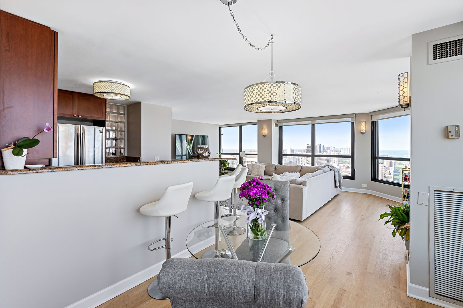 1030 North State Street, Unit 31E Chicago, IL 60610 - Photo 8 of 19 a view of a dining room with furniture and a chandelier