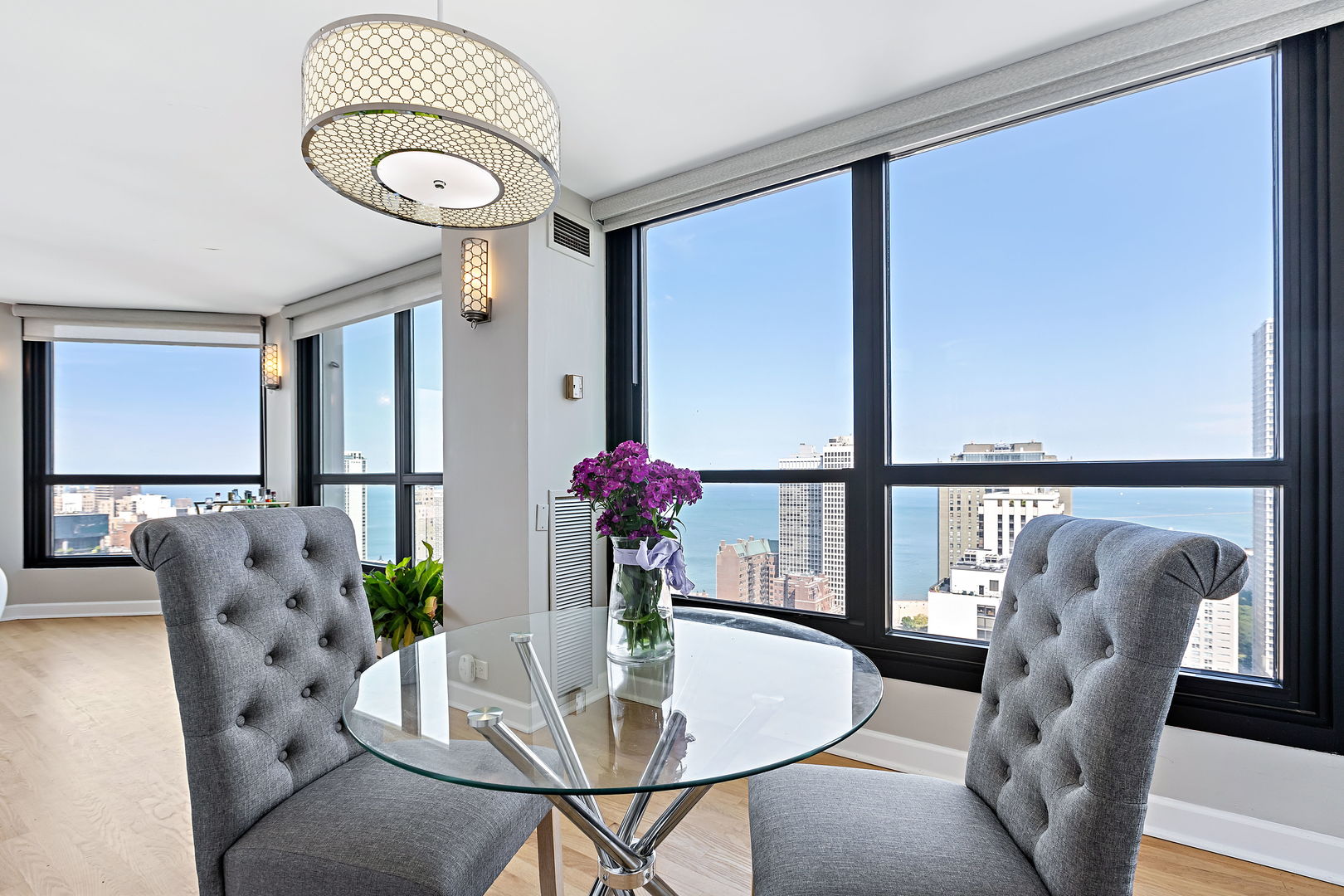 1030 North State Street, Unit 31E Chicago, IL 60610 - Photo 9 of 19 a dining room with furniture and window