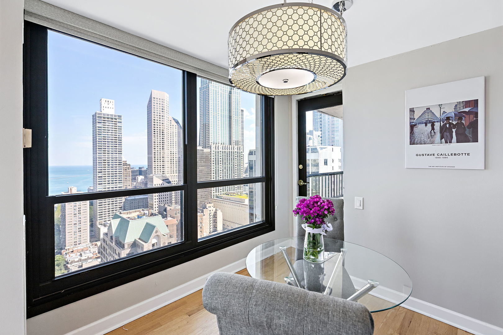 1030 North State Street, Unit 31E Chicago, IL 60610 - Photo 10 of 19 a living room with furniture and a potted plant
