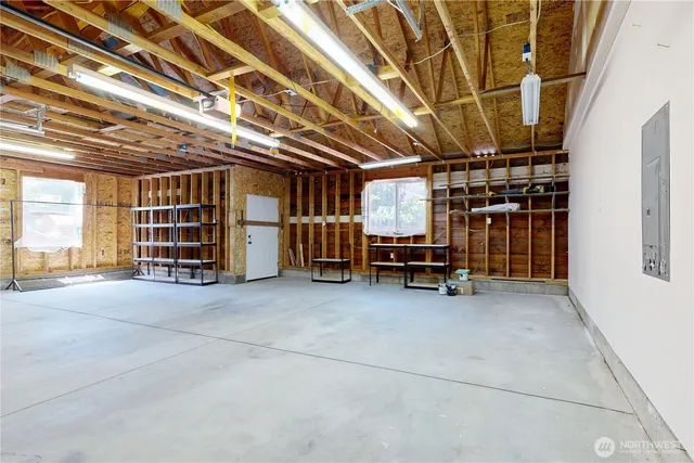 a view of an empty room with gym equipment