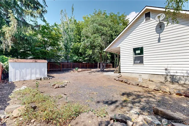a backyard of a house with lots of green space