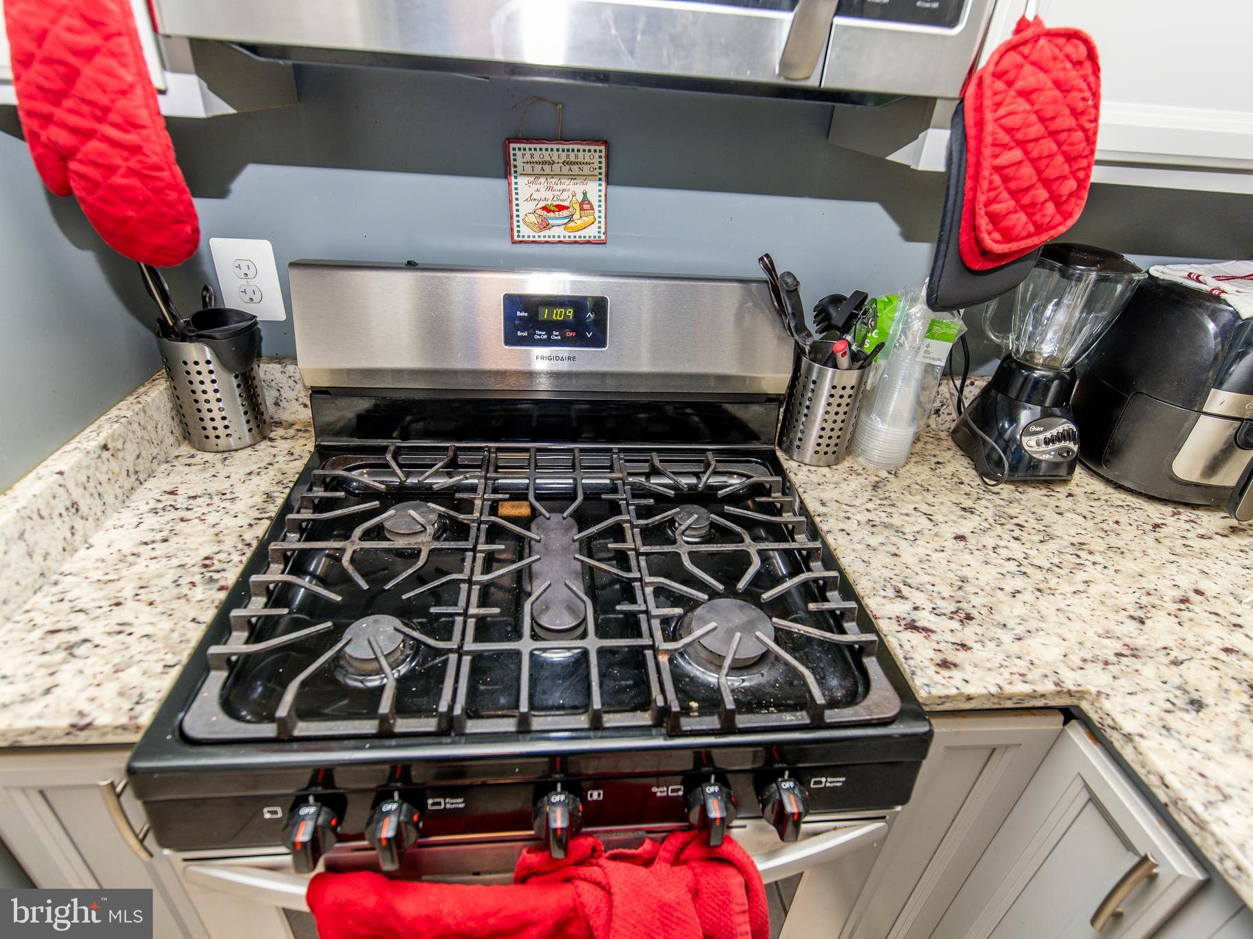 3934 Bel Pre Road, Unit 39342 Silver Spring, MD 20906 - Photo 9 of 30 a stove top oven sitting inside of a kitchen