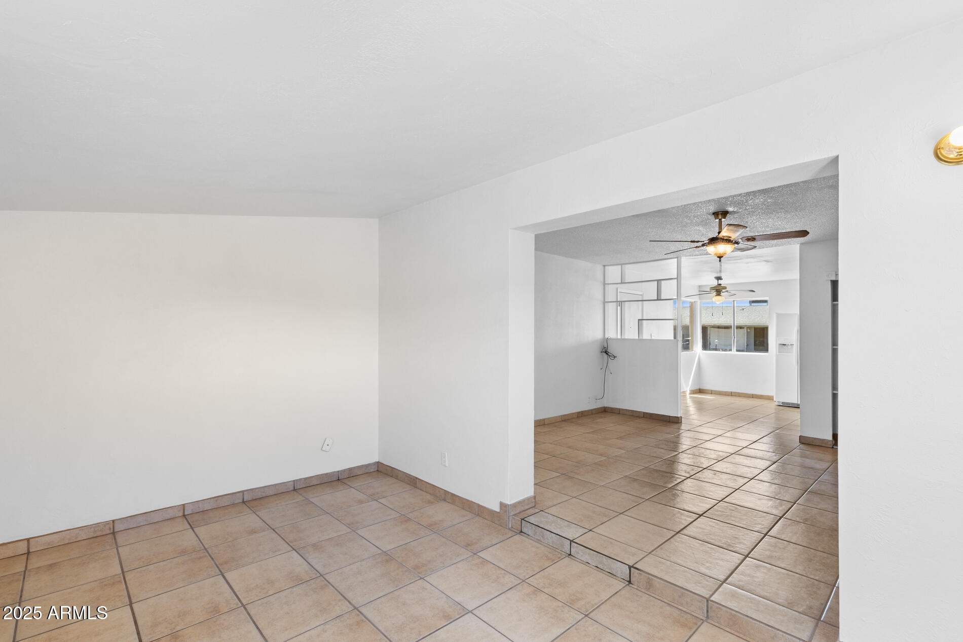 2230 East Chipman Road Phoenix, AZ 85040 - Photo 14 of 26 a view of a kitchen space with wooden floor and a kitchen space
