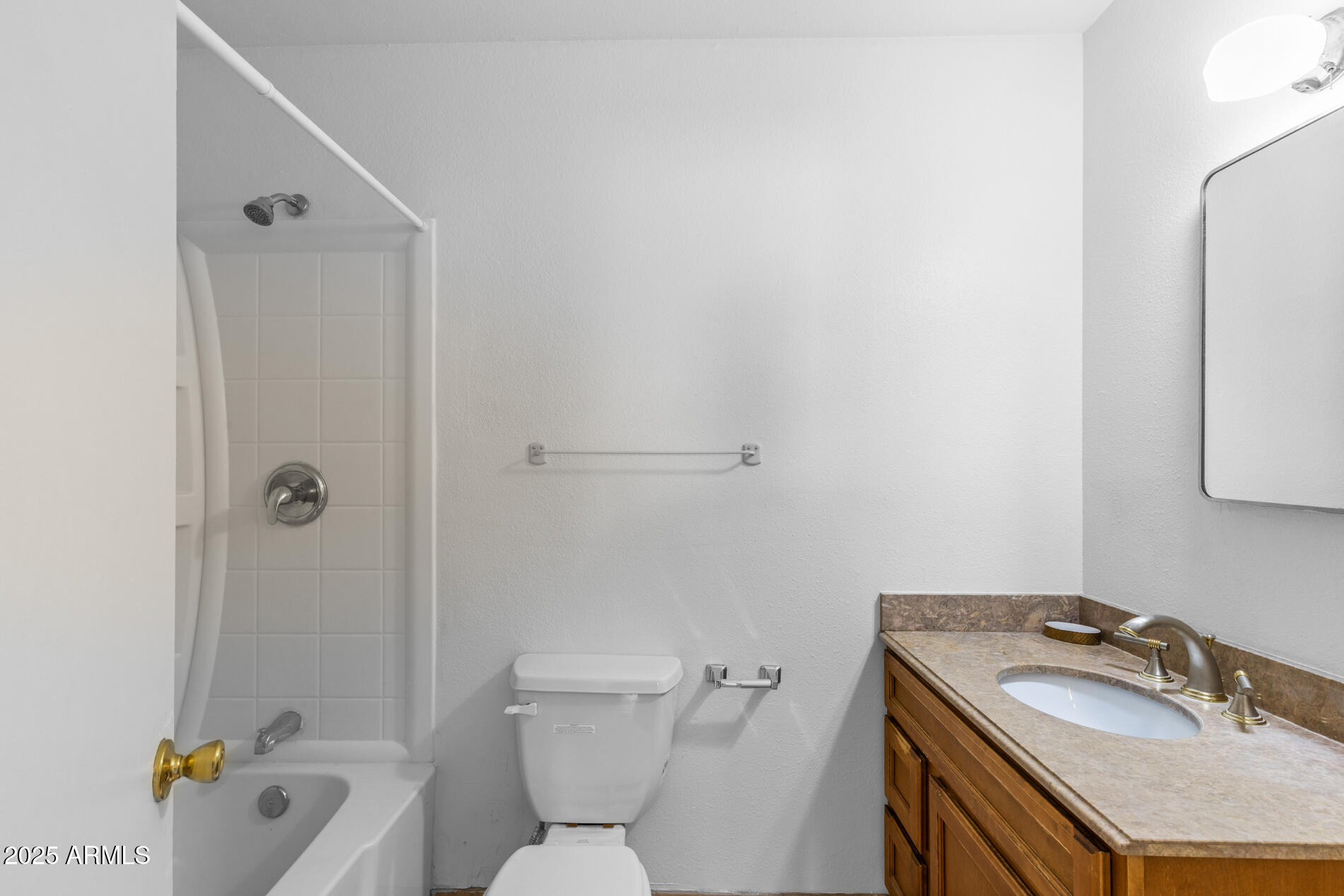 2230 East Chipman Road Phoenix, AZ 85040 - Photo 17 of 26 a bathroom with a granite countertop sink toilet and shower