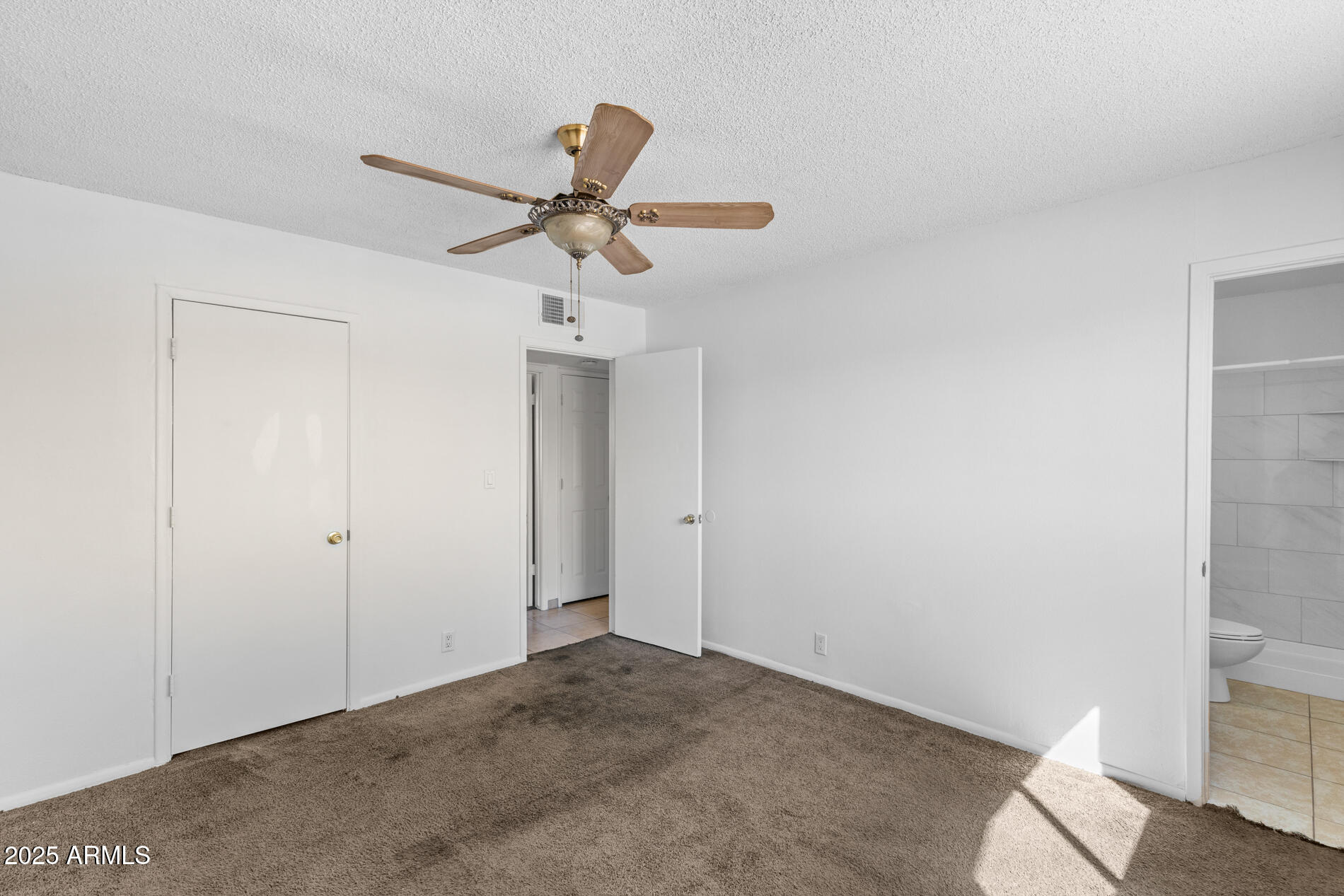 2230 East Chipman Road Phoenix, AZ 85040 - Photo 20 of 26 a view of a room with a ceiling fan