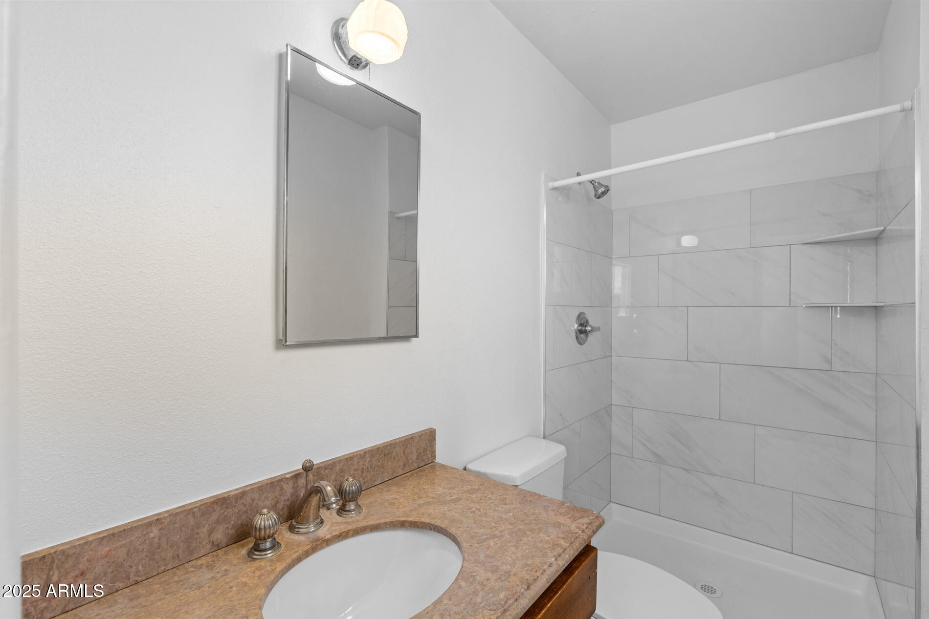 2230 East Chipman Road Phoenix, AZ 85040 - Photo 21 of 26 a bathroom with a granite countertop sink toilet and shower