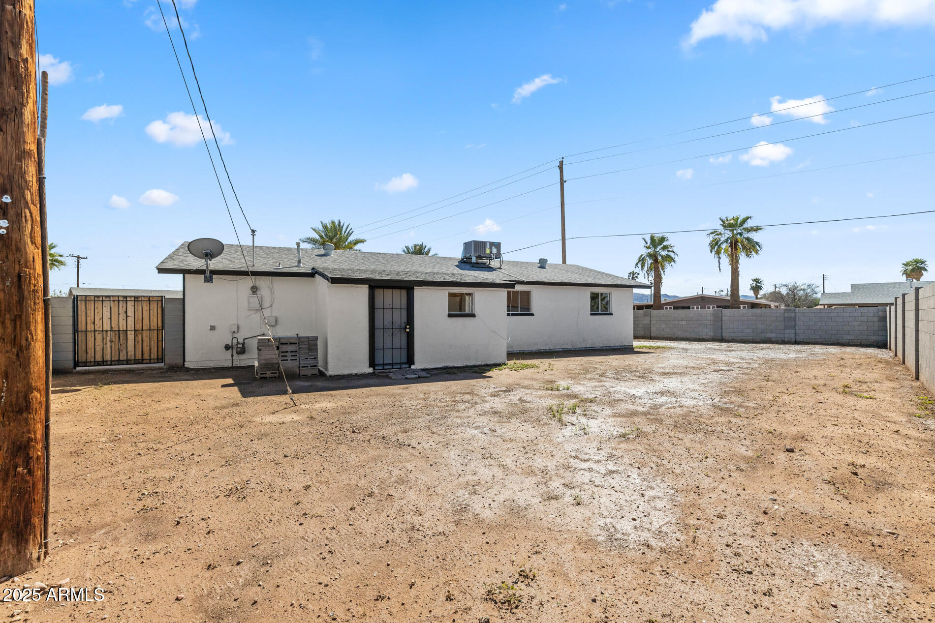 2230 East Chipman Road Phoenix, AZ 85040 - Photo 25 of 26 a view of a house with a snow in the yard