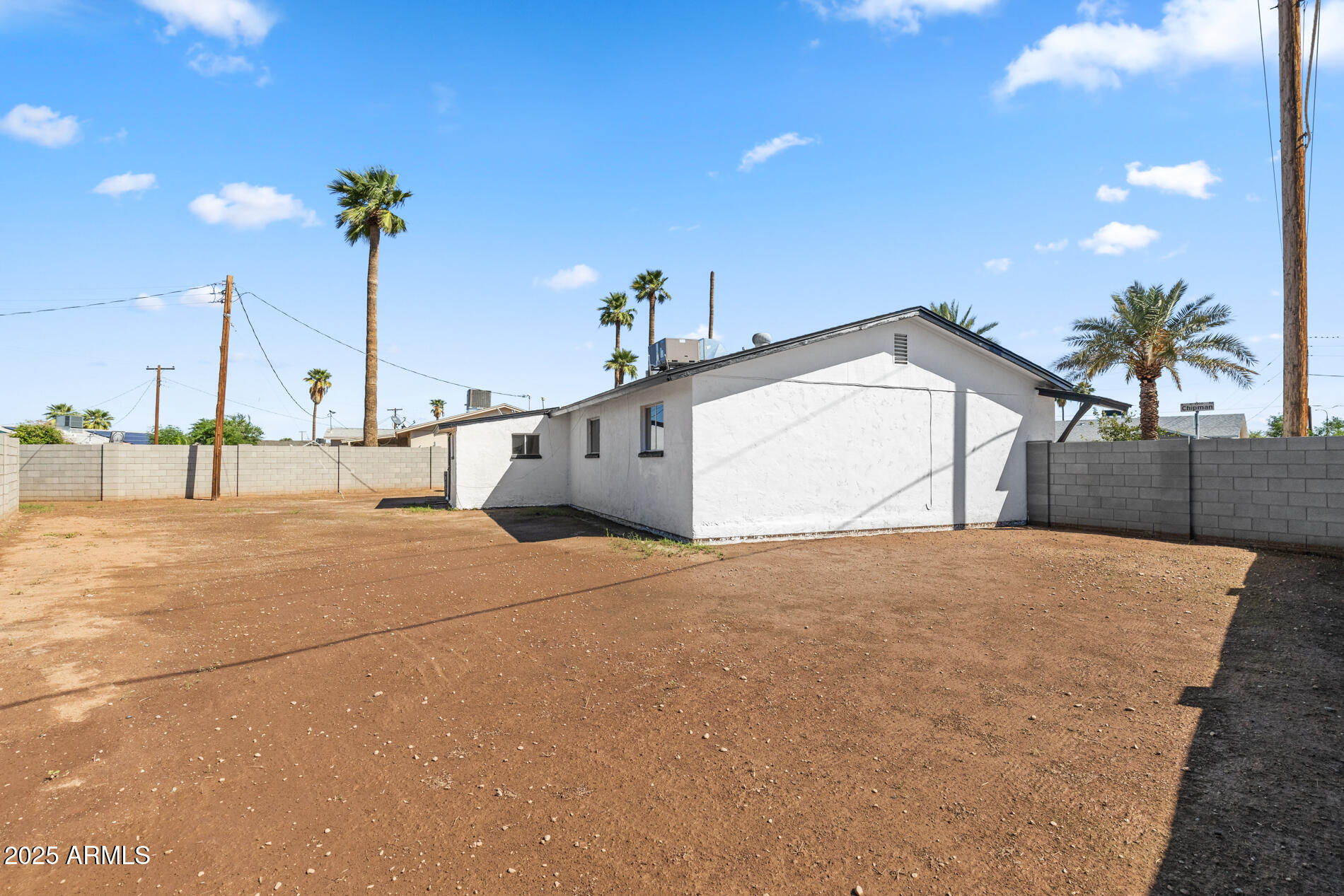 2230 East Chipman Road Phoenix, AZ 85040 - Photo 26 of 26 a view of a house with a garage and a street