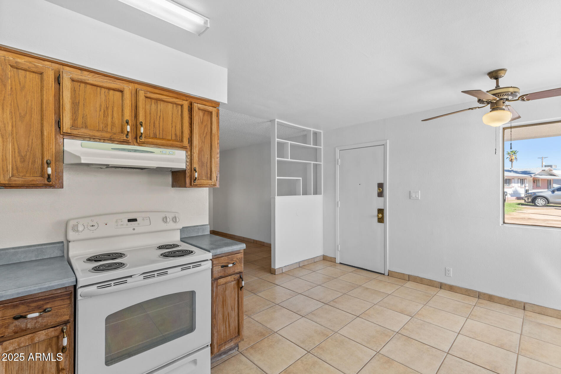 2230 East Chipman Road Phoenix, AZ 85040 - Photo 9 of 26 a kitchen with stainless steel appliances granite countertop a stove and a refrigerator