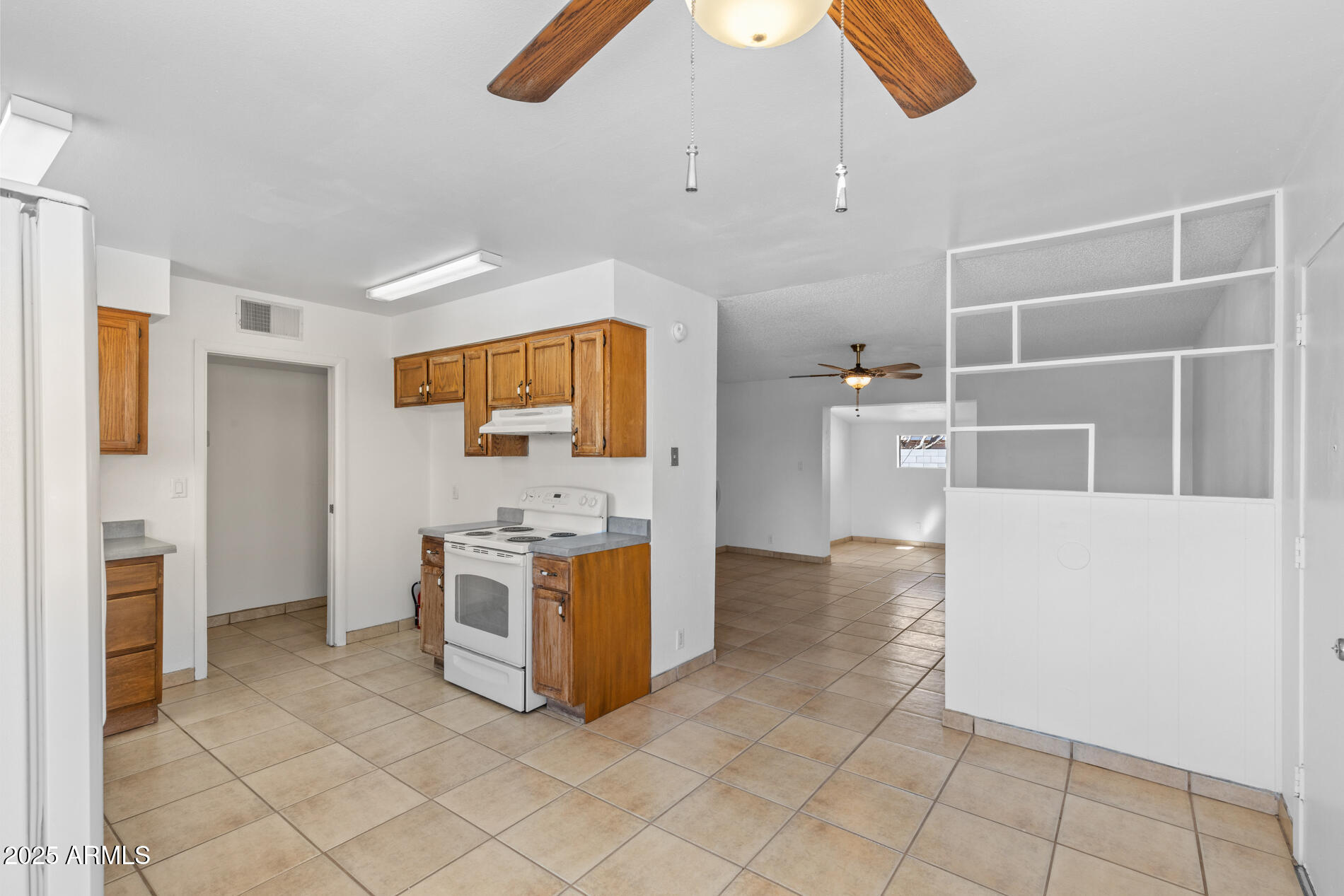 2230 East Chipman Road Phoenix, AZ 85040 - Photo 10 of 26 a kitchen with a stove and a refrigerator