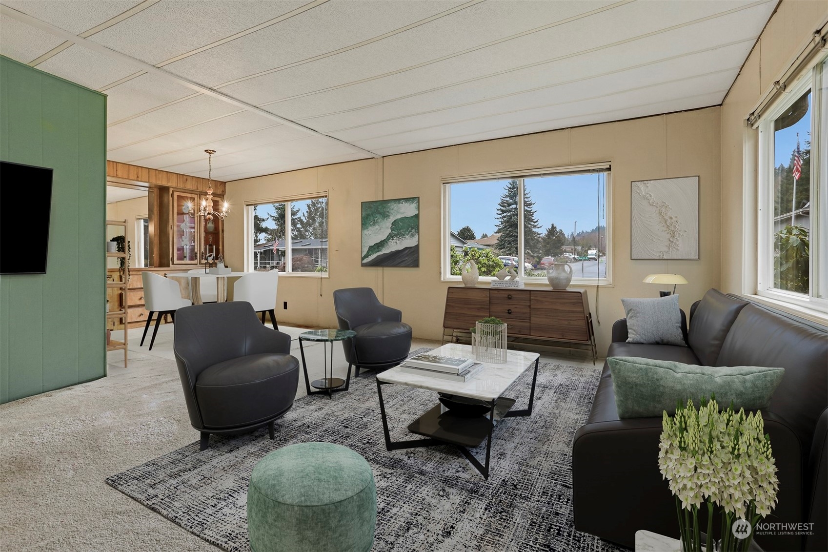 714 Wandering Creek Drive Bothell, WA 98021 - Photo 15 of 39 a living room with furniture and a flat screen tv