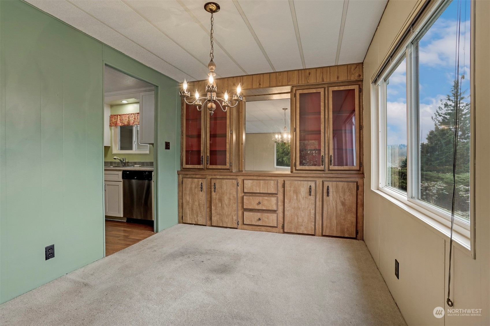 714 Wandering Creek Drive Bothell, WA 98021 - Photo 19 of 39 a view of a kitchen with a sink and cabinet with wooden floor