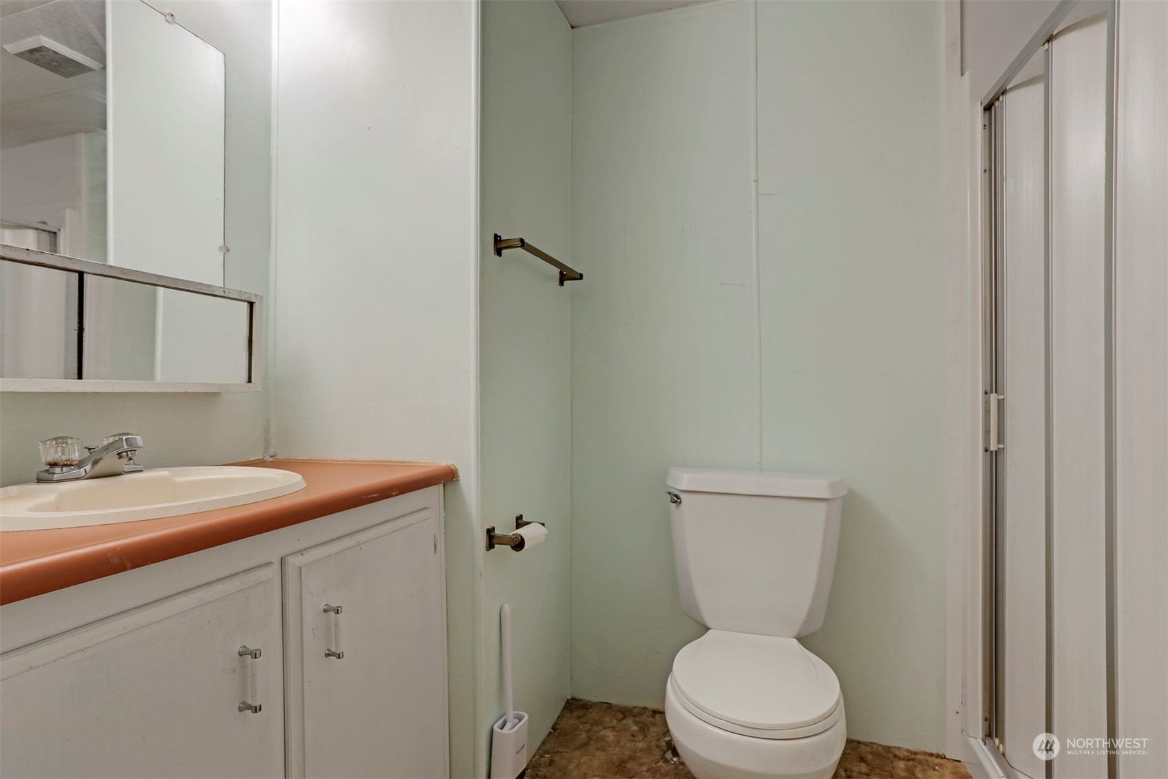 714 Wandering Creek Drive Bothell, WA 98021 - Photo 27 of 39 a bathroom with a granite countertop toilet sink and mirror