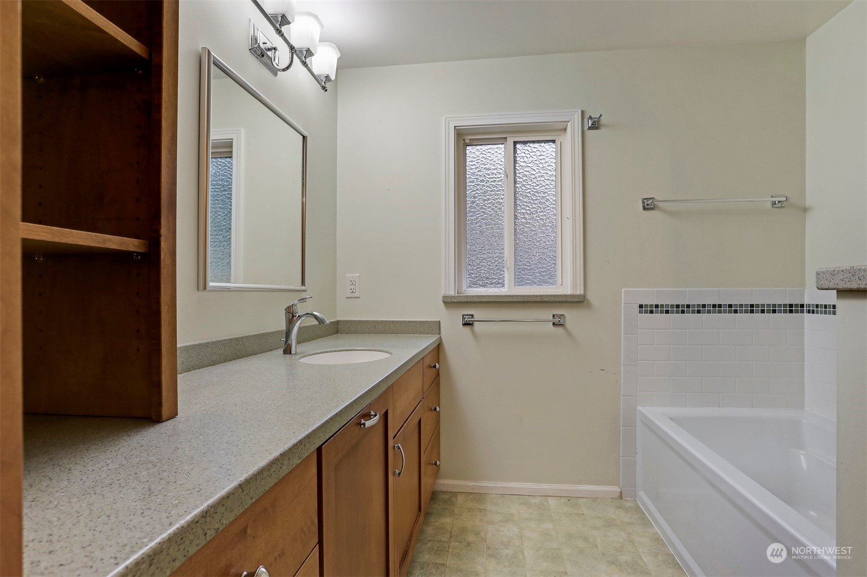 714 Wandering Creek Drive Bothell, WA 98021 - Photo 31 of 39 a bathroom with a granite countertop sink mirror and a bathtub