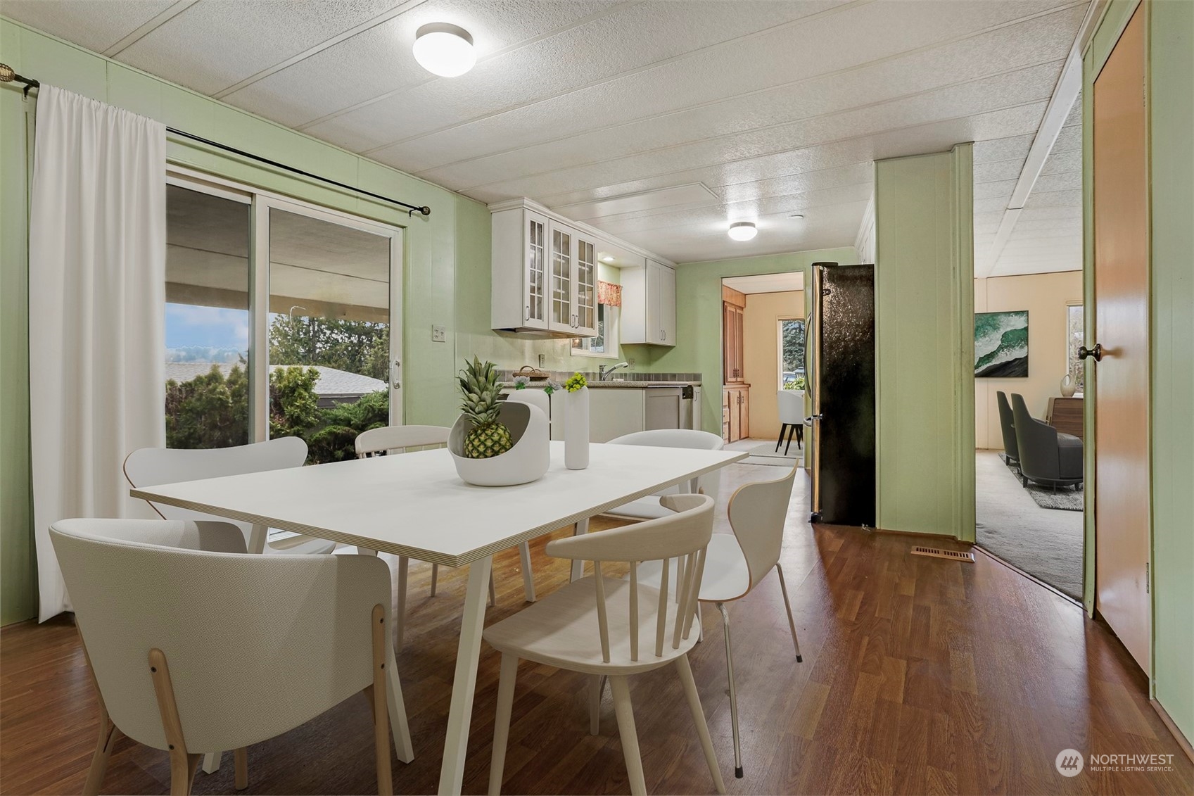 714 Wandering Creek Drive Bothell, WA 98021 - Photo 8 of 39 a view of a dining room with furniture window and wooden floor