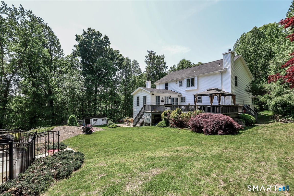 55 A Flax Hill Road Brookfield, CT 06804 - Photo 6 of 40 a view of a house with a big yard and large trees