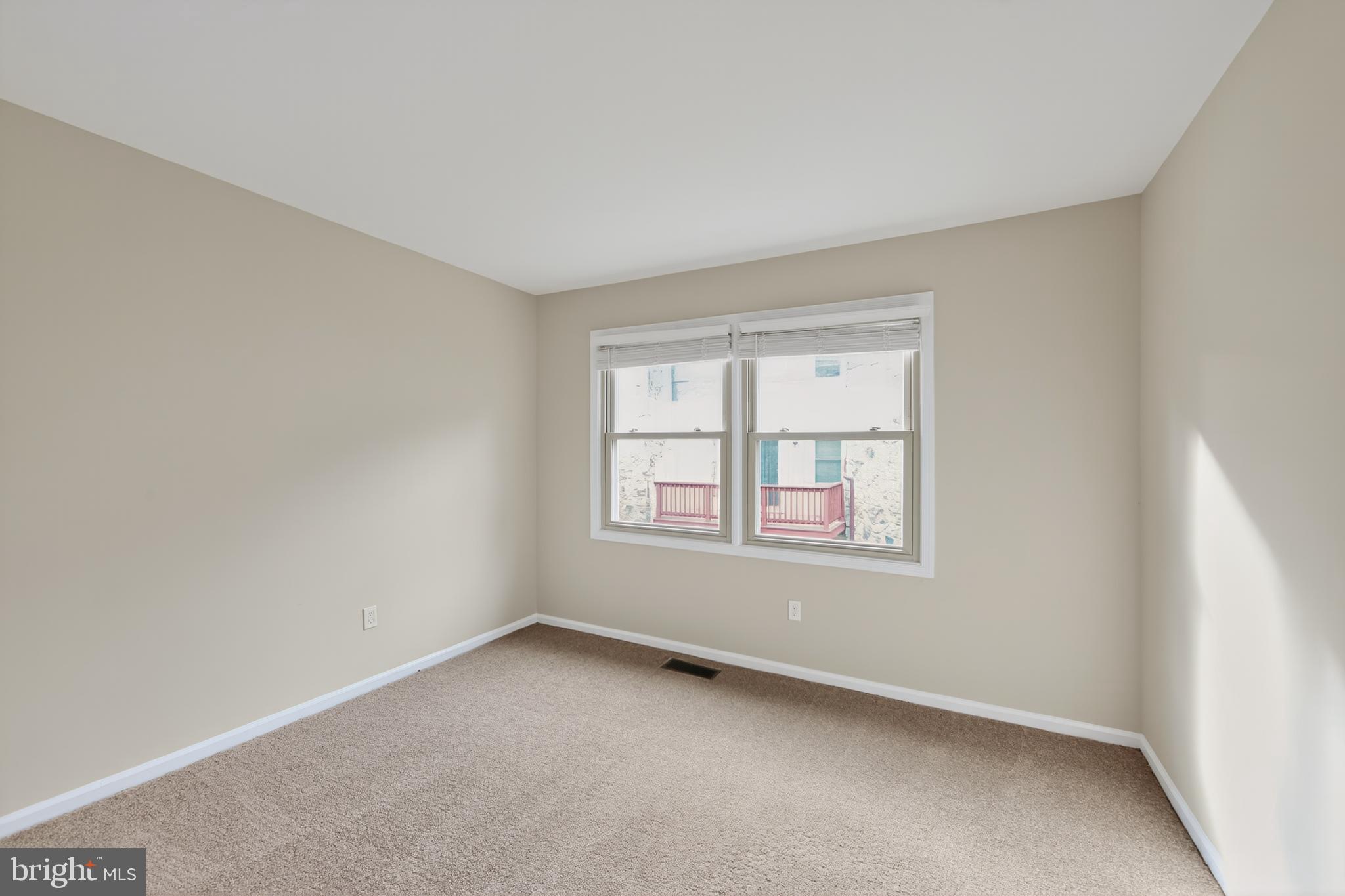 107 Reveille Road, Unit 107 Chesterbrook, PA 19087 - Photo 11 of 22 an empty room with a window