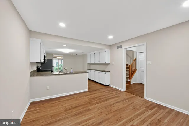 a view of kitchen and wooden floor