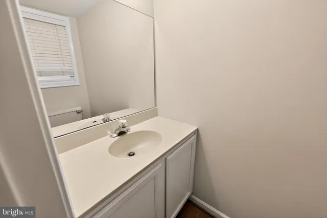 a bathroom with a sink and a vanity