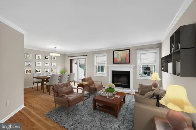 a living room with furniture fireplace and a flat screen tv