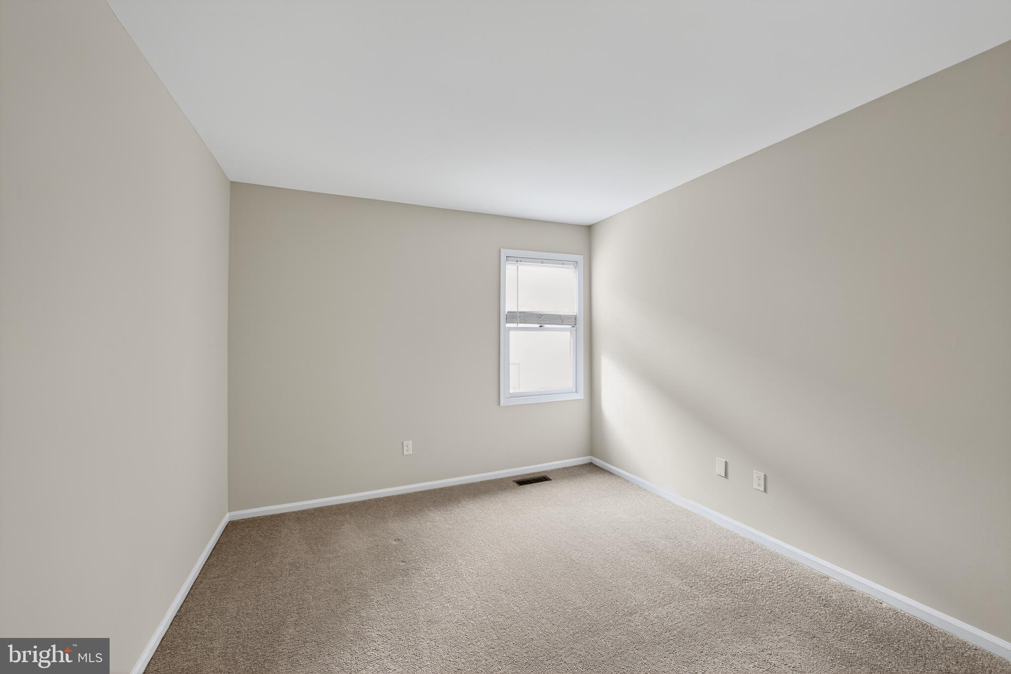 107 Reveille Road, Unit 107 Chesterbrook, PA 19087 - Photo 9 of 22 a view of an empty room and a window