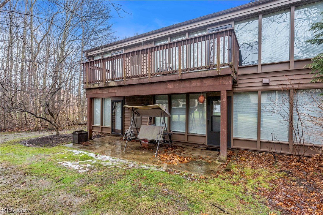 985 Canyon View Road, Unit 108D Northfield, OH 44067 - Photo 17 of 18 Back of house with a sunroom and a patio area