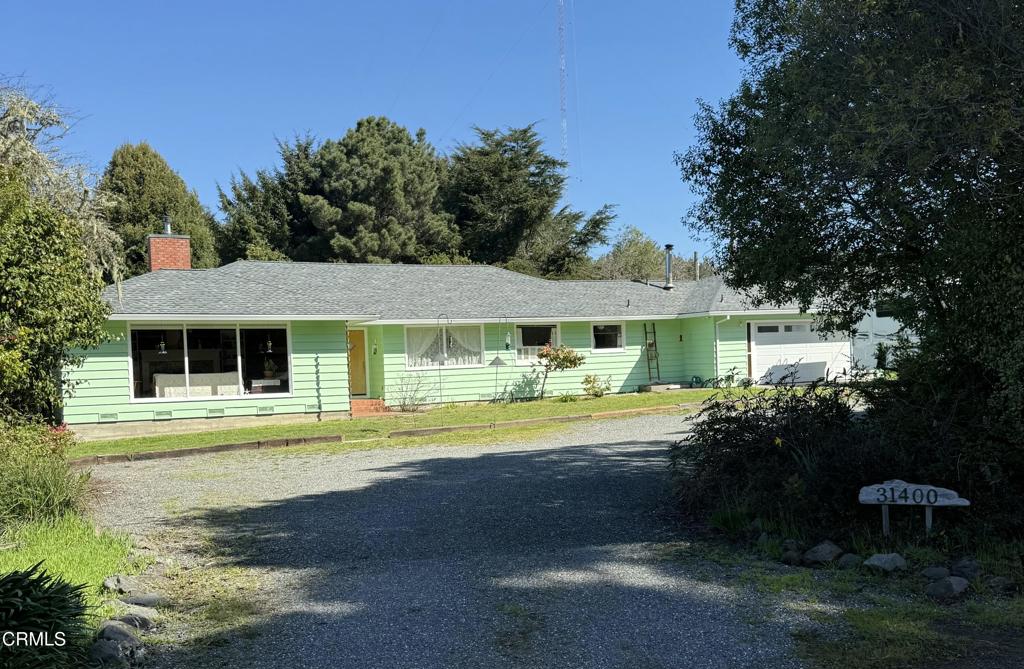 31400 Sherwood Road Fort Bragg, CA 95437 - Photo 4 of 55 a front view of a house with garden