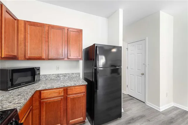 a bathroom with a toilet a sink and a mirror