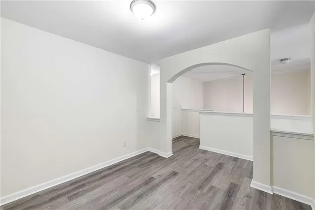 a bathroom with a sink a toilet and a large mirror